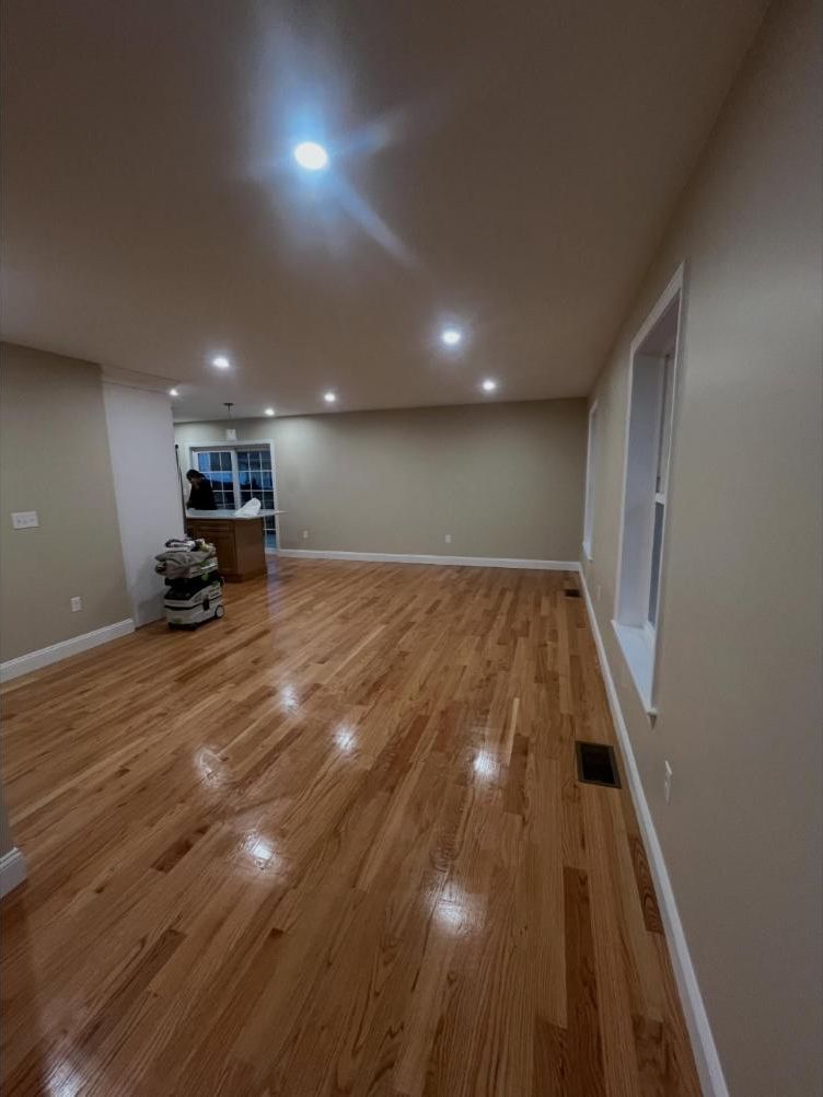 Open living area with glossy hardwood floors